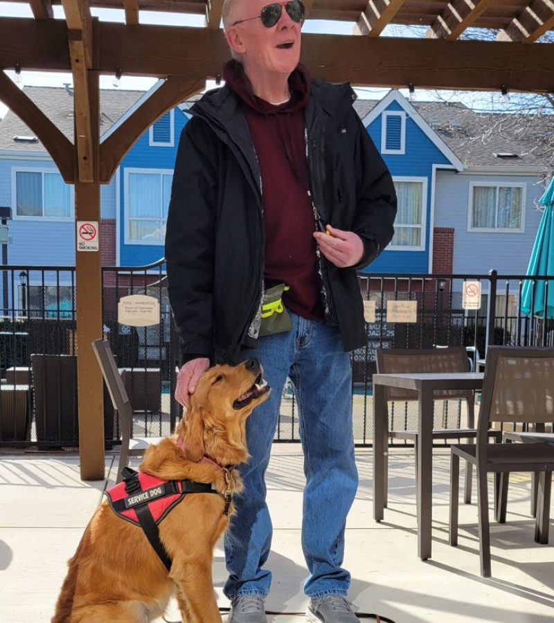 Service Dog Geo being trained outdoors by Jim
